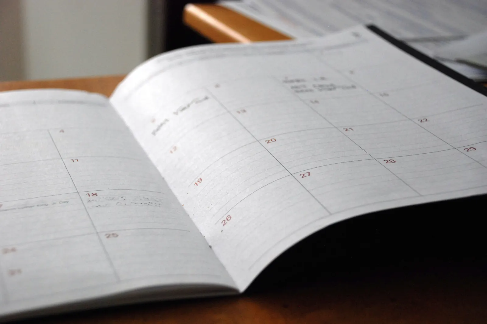An open monthly planner on a desk