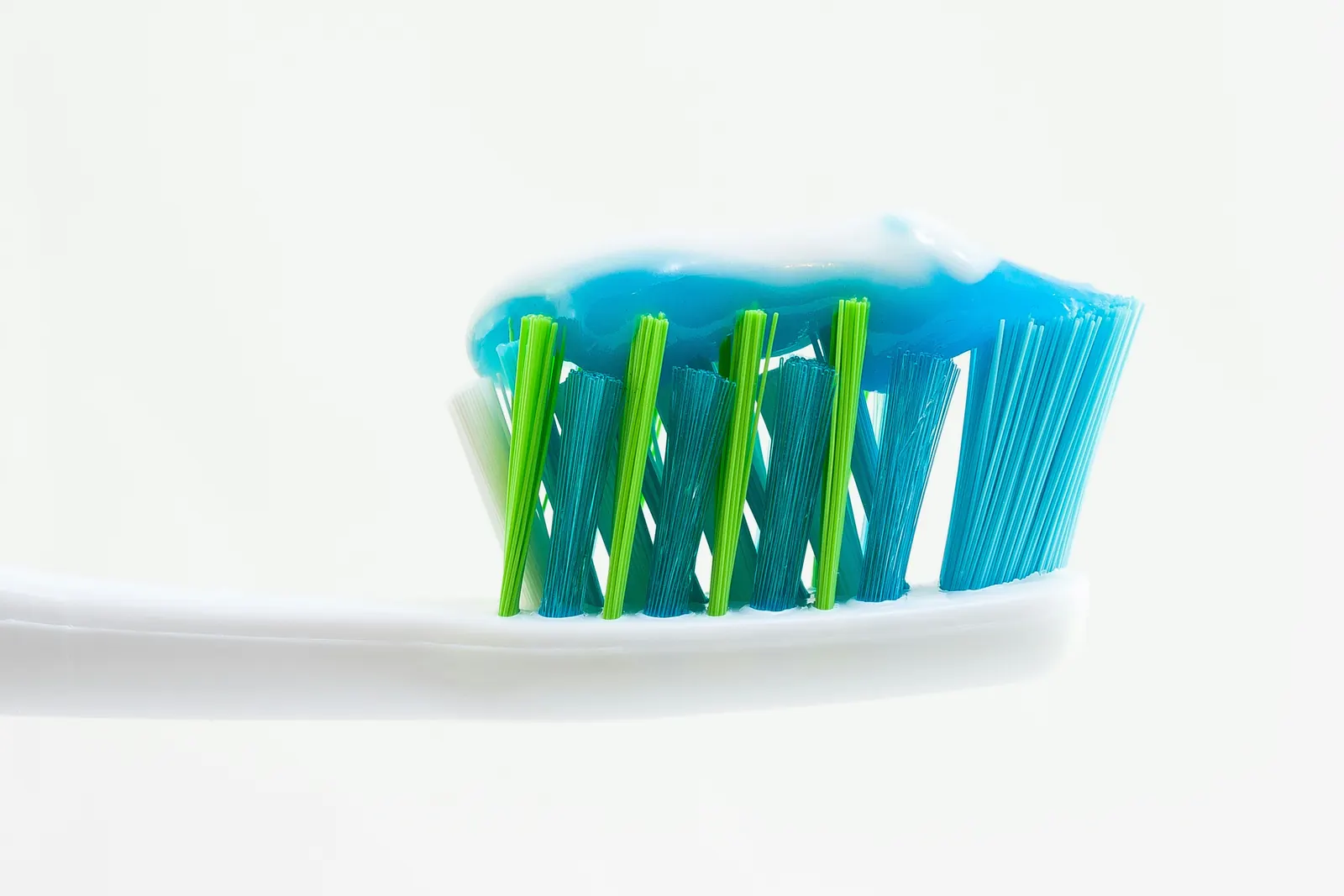 A toothbrush with toothpaste on the bristles